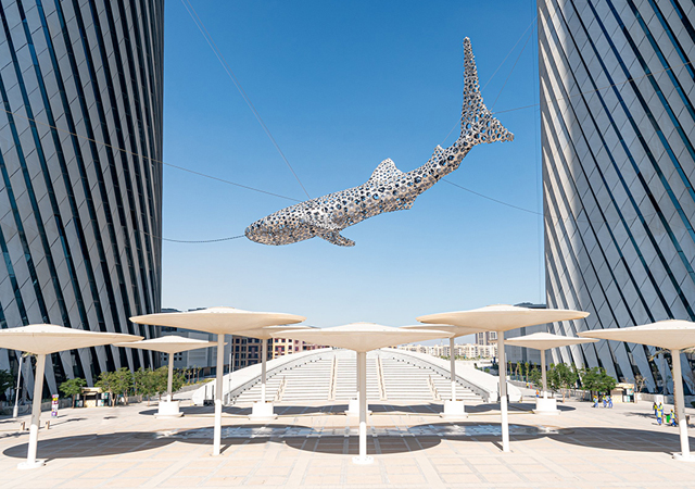 The streets and shaded terraces create an inviting public realm at ground level.